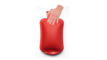 A hand on the top of a hot water bottle.
