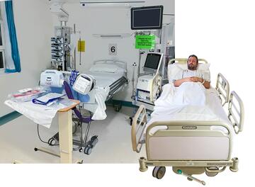 Two hospital beds on a ward. One bed is being used by a male adult 