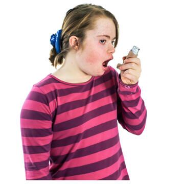 A girl using an inhaler.