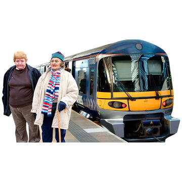 2 people on a train platform with a train behind them.