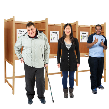 A group of people standing in front of a row of voting booths