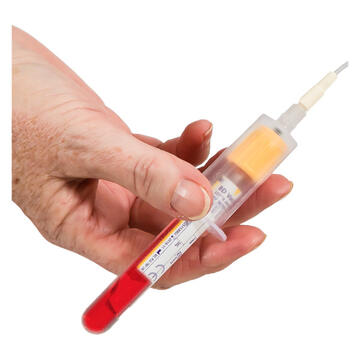A hand holding a tube with blood in it.