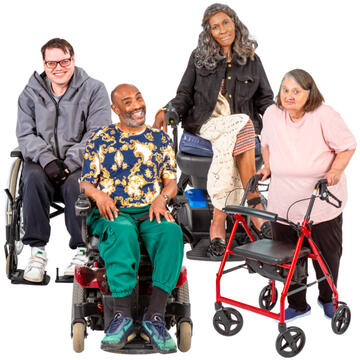 A group of 4 people: 3 are in wheelchairs and 1 is using a walking frame.