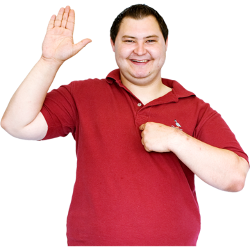 A smiling man with one hand raised and the other pointing to his chest