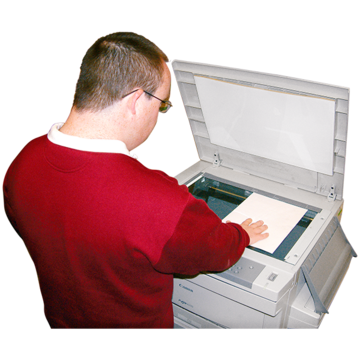 A man using a photocopier