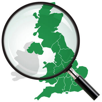 A magnifying glass over a map of the UK.