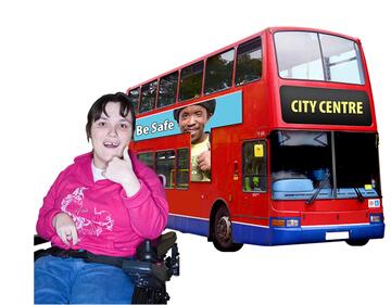 A lady in a wheelchair beside a bus with her thumb up.