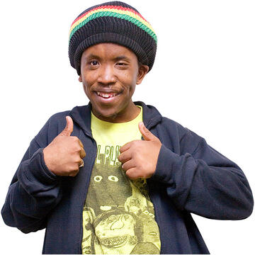 A man smiling with his thumbs up.
