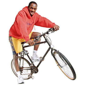 A man on a bike.