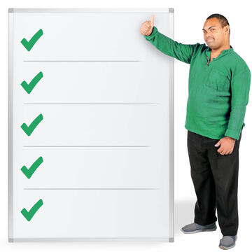 A man with his thumb up beside a piece of paper with several ticks on it.