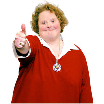 A lady with her thumb up.