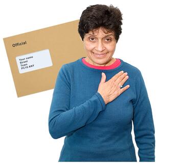 A lady pointing to herself with a letter in a brown envelope behind her.
