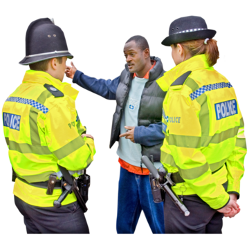 Two police officers talking to a man
