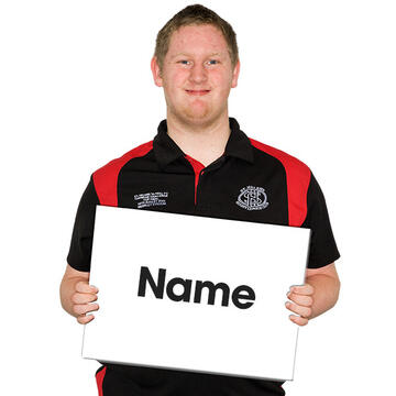 A man holding a sign saying name.