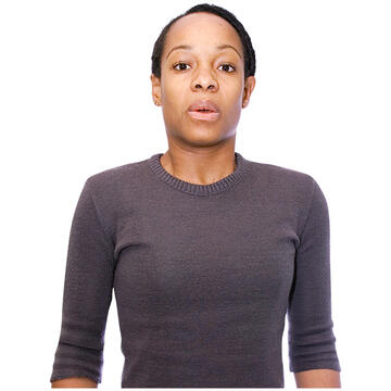 A lady breathing out with her mouth open.