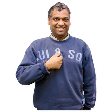 A man pointing to himself.