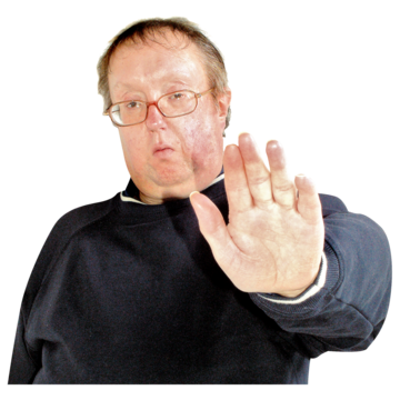 A man holding his hand out in front of him to say stop