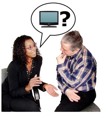 A lady looking at a man with a speech bubble above her.  In the speech bubble is a tv and a question mark.
