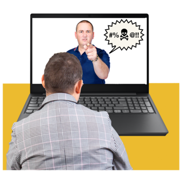 A man looking at a laptop, on the screen is an angry man pointing and shouting