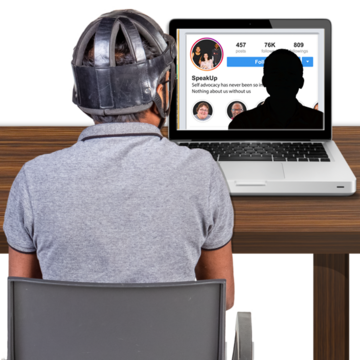 A person looking at a laptop screen with an anonymous outline on the screen