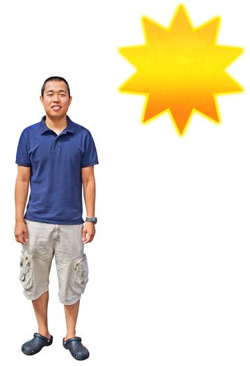 A man wearing shorts and a tshirt with the sun behind him.