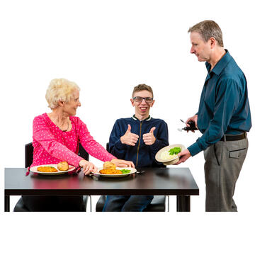 A man and a woman offering a boy different plates of food.  The boy is smiling and has his thumbs up.