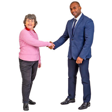 A woman and a man shaking hands.