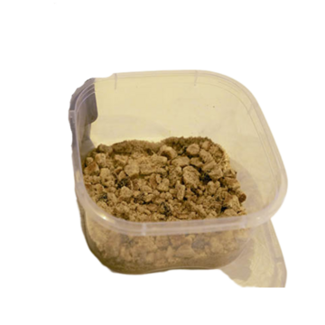 Crumbs of Welshcake in a tub.