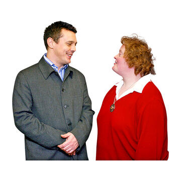 A man and a woman talking to each other