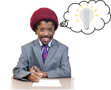 A man sitting at a table with a pen and paper and a thought bubble by his head with a light bulb in it.