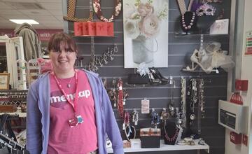 A photograph of Emma in a Mencap shop