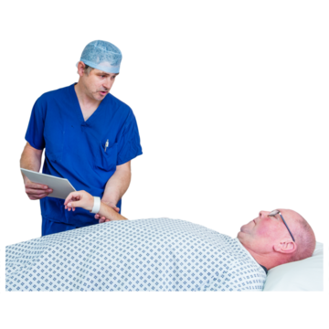 A doctor taking the pulse of a man lying on a hospital operating table