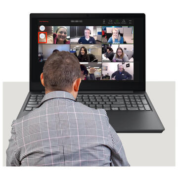 A man sitting at a laptop in a virtual meeting.