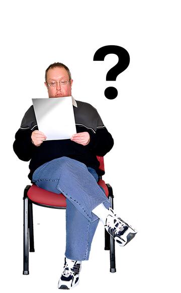 A man sitting on a chair reading with a question mark above him.