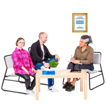 A man and a young woman are talking to a woman with a clipboard sitting around a coffee table.