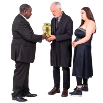 A man is handing an urn to another man and his daughter