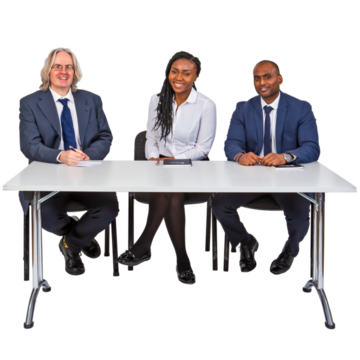 Three managers sitting behind a desk
