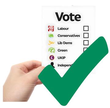 A green tick beside a hand holding a ballot paper.