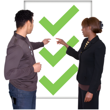 Two people pointing at a board with three green ticks