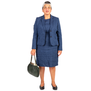 A woman in a smart suit with a handbag