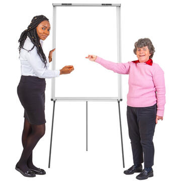 2 people standing beside a flipchart and pointing to it.