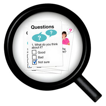 A magnifying glass showing some questions.