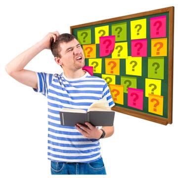 A man reading a book and scratching his head.  Behind him is a board full of post its with question marks on.