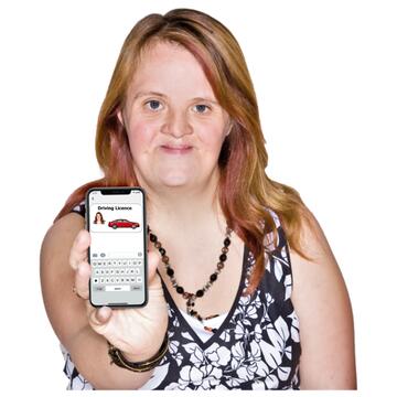 A woman showing her phone screen which has her driving licence on it.