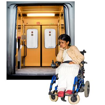 A train with the doors open and a lady in a wheelchair on the platform looking fed up.