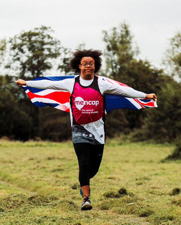 Michael running with the Union Jack Flag.