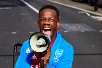 Brendan campaigning outside with a megaphone. 