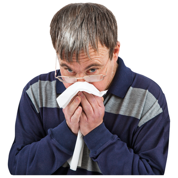 A man using a tissue to blow his nose