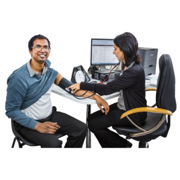 A healthcare professional taking the blood pressure of a smiling patient.