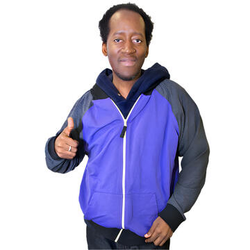 A man wearing a tracksuit with his thumb up.
